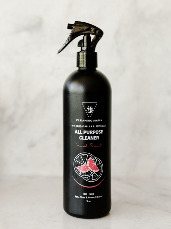 Cleaning Mama plant-based Fresh Scent All Purpose Cleaner in a black spray bottle against a light marble background.