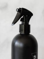 Close-up of Cleaning Mama’s new black bottle sprayer featuring a child-safe locking mechanism and leakproof design.