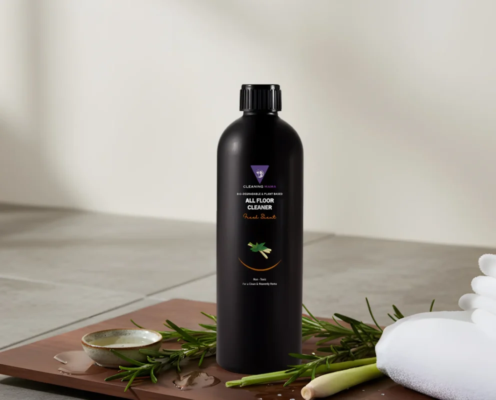 A bottle of Cleaning Mama All Floor cleaner containing natural, non-toxic ingredients, sits on a counter.