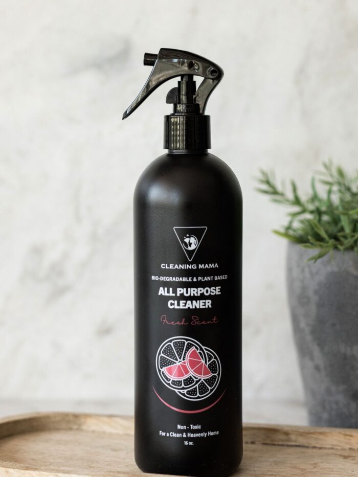 Cleaning Mama plant-based Fresh Scent All Purpose Cleaner in a black spray bottle displayed on a wooden board