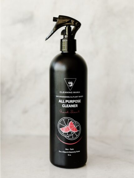 Cleaning Mama non-toxic, plant-based Fresh Scent All Purpose Cleaner in a black spray bottle sitting on a marble countertop.