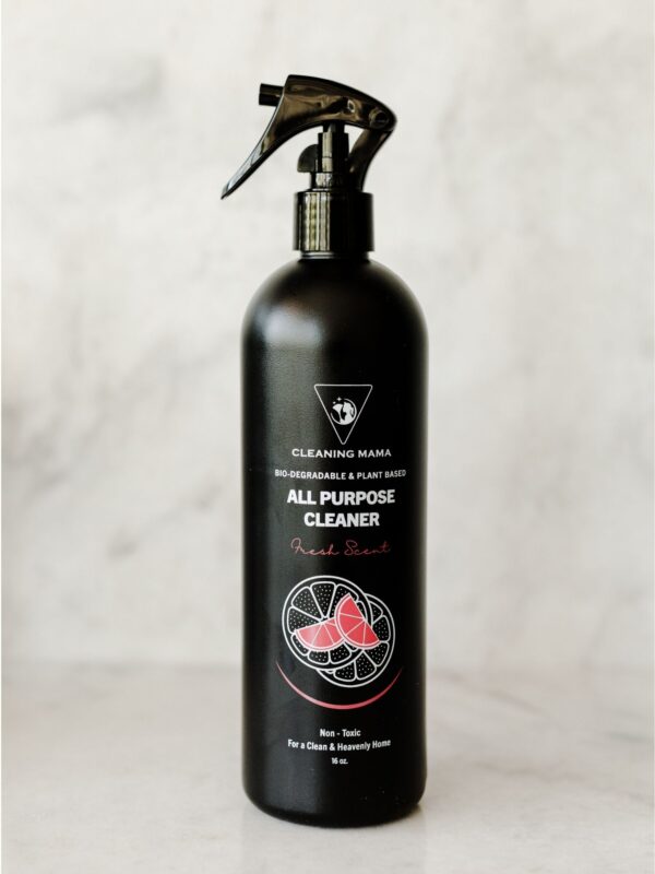 Cleaning Mama non-toxic, plant-based Fresh Scent All Purpose Cleaner in a black spray bottle sitting on a marble countertop.