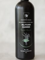 Close-up of the Cleaning Mama plant-based Fresh Scent All Floor Cleaner label with green botanical artwork on a black bottle.