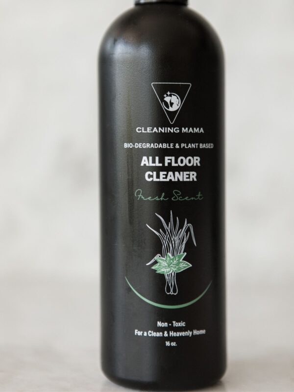 Close-up of the Cleaning Mama plant-based Fresh Scent All Floor Cleaner label with green botanical artwork on a black bottle.