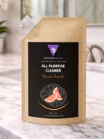 Cleaning Mama plant-based Fresh Scent All Purpose Cleaner refill pouch displayed on a marble bathroom counter.