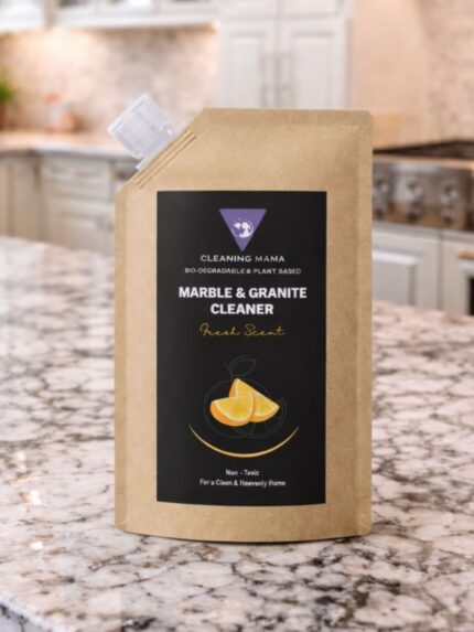 Cleaning Mama plant-based Fresh Scent Marble & Granite Cleaner refill pouch displayed on a granite kitchen countertop.