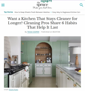 A screenshot showing the headline "Want a kitchen that stays cleaner longer? Cleaning Pros share Habits that Help it Last" on The Spruce website with an image of a kitchen