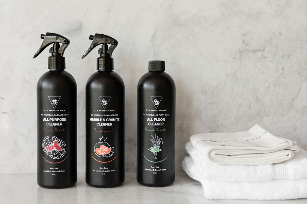 Cleaning Mama Fresh Scent cleaning trio featuring All Purpose, Marble & Granite and All Floor Cleaner beside folded white cleaning cloths.